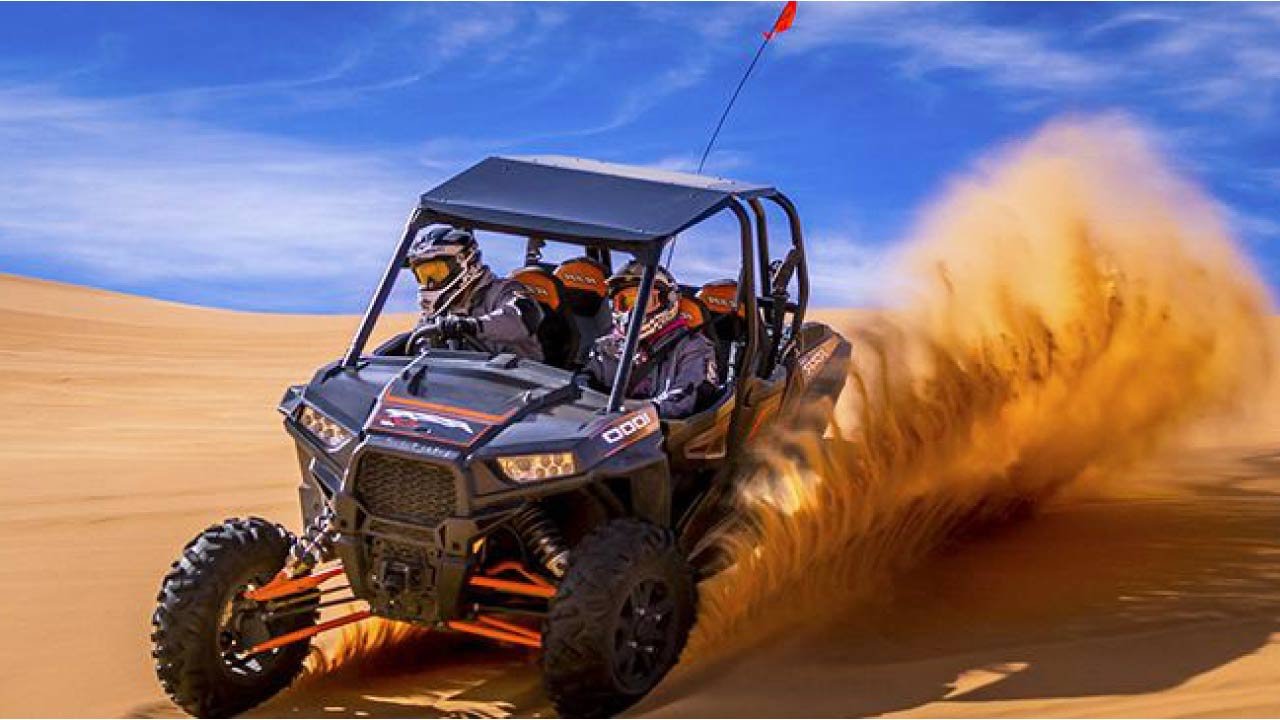 Polaris RZR 2-seater dune buggy in the Dubai desert