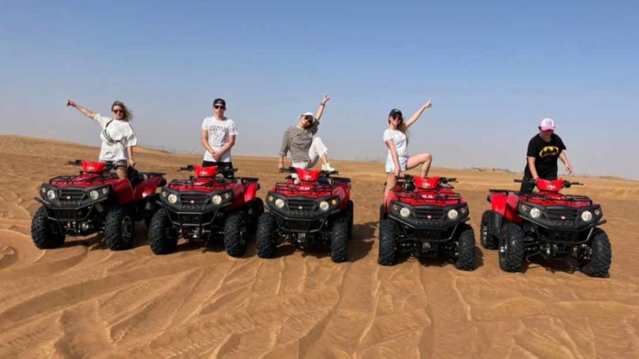 Quad bike riding across the Lahbab red dunes in Dubai